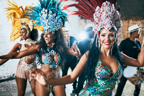Preview: Cropped shot of beautiful samba dancers performing in a carnival with their band