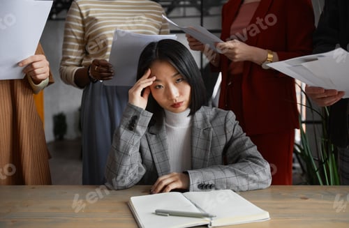 Preview: Stressed Asian Businesswoman at Work