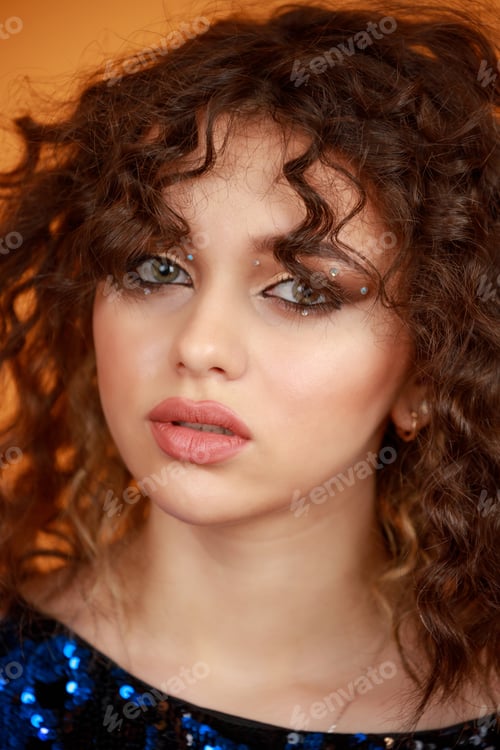 Preview: Close-up photo of young curly-haired girl. Headshot photo