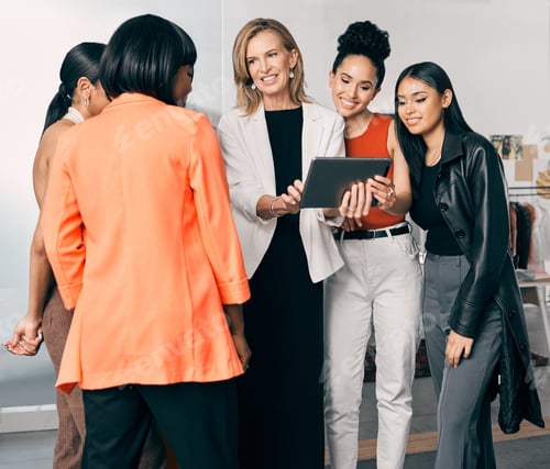 Preview: Theyve got a plan. Shot of a group of businesswomen using a digital tablet together at work.