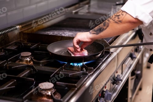 Preview: Chef making delicious duck breast in pan