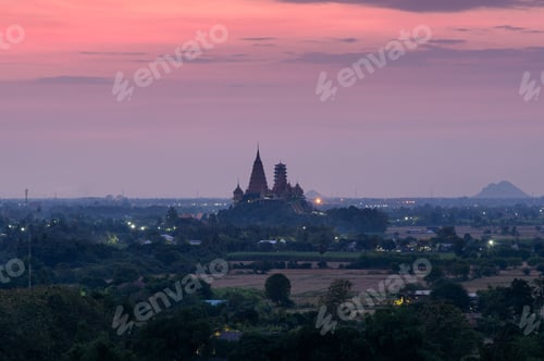 Preview: Wat Tham Sua temple on hill with colorful sky at dawn