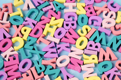 Preview: Lots of scattered multicolored letters. Learning to read, alphabet.