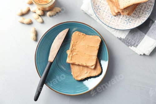 Preview: Tasty toasts with peanut butter on plate