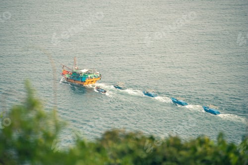 Preview: Group of fishing boats heading home after a day of work