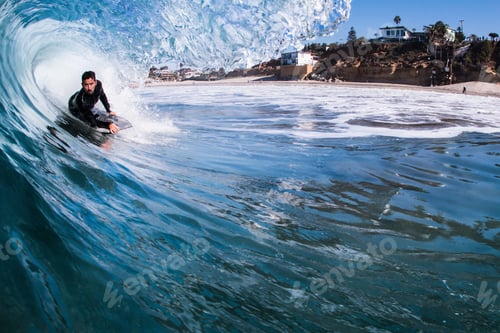 Preview: Man surfing in sea, Encinitas, California, USA
