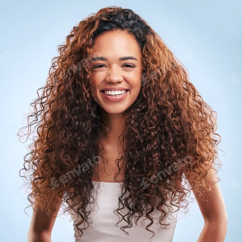 Preview: Cropped portrait of an attractive young woman posing in studio against a grey background