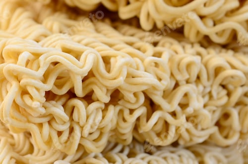 Preview: Close up view of yellow dry instant noodles. Chinese traditional food