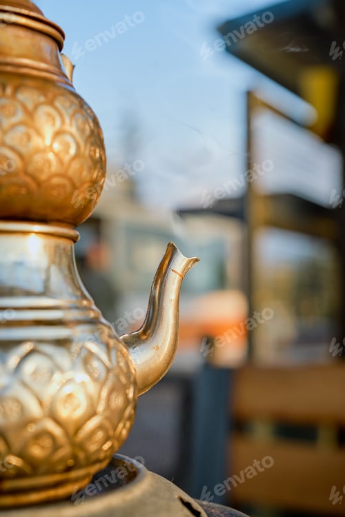 Preview: Selective focus on a Turkish teapot with rising steam from