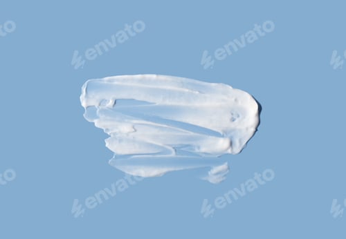 Preview: Cosmetic smear of cream texture on a blue background. Large cream smear. Skin care.