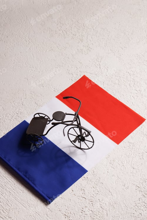 Preview: Tour de France Cycling Race concept. toy bicycles with the flag of France on white background.