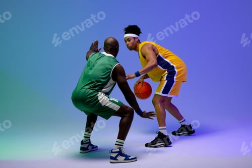 Preview: Image of two diverse basketball players with basketball playing on purple to green background
