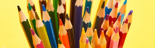 Preview: Panoramic shot of sharpened end bright color pencils isolated on yellow