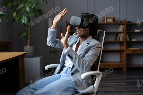 Preview: Business woman surprised wear VR glasses at office scared with simulation of virtual reality goggles