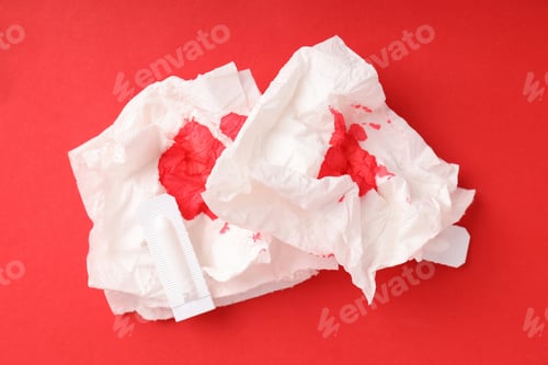 Preview: Concept of healthcare with hemorrhoids accessories on red background