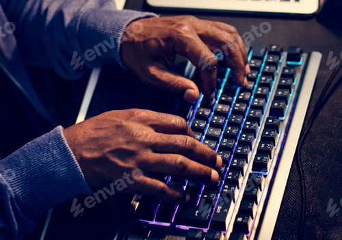 Preview: Closeup of hands working on computer keyboard