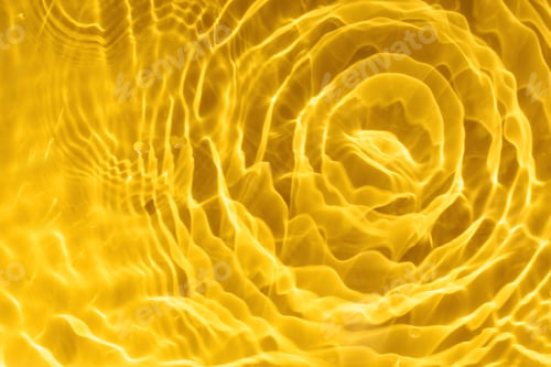 Preview: Abstract background of yellow water with ripples under sunlight. Top view, copy space.