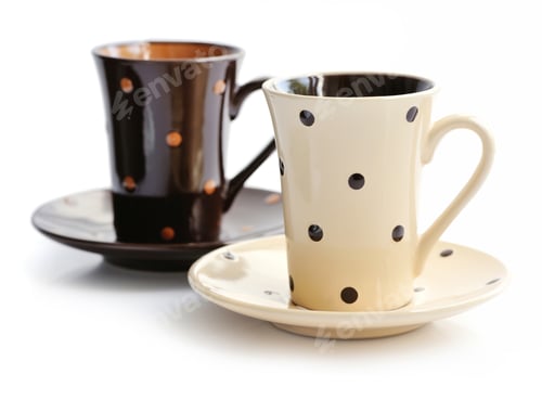 Preview: Coffee cups and saucers isolated on white