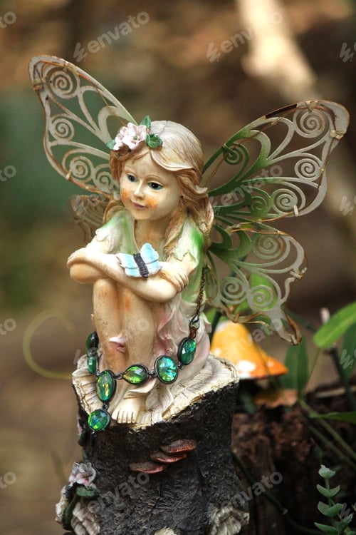 Preview: Statue of a little fairy in the back of the garden