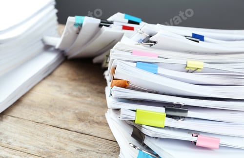 Preview: Pile of documents with colorful binder clips on wooden table, closeup