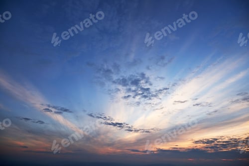 Preview: Golden light shining through the clouds in a colorful evening