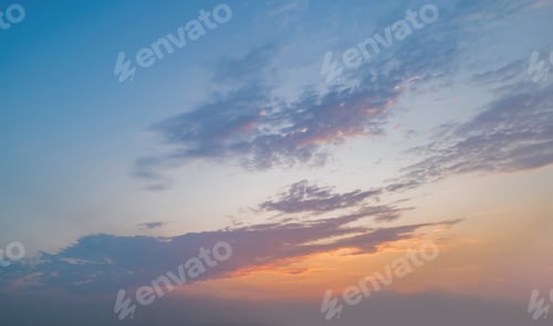 Preview: Sunset sky. Abstract nature background. Dramatic blue and orange, colorful clouds at twilight time.
