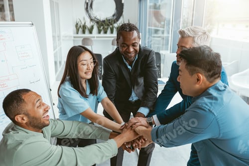 Preview: Top view of group multi ethnic coworkers stacked hands together as concept of corporate unity