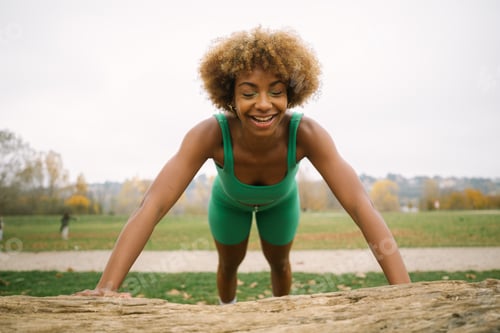 Preview: Candid of a Young woman with afro and wearing green and practicing sport