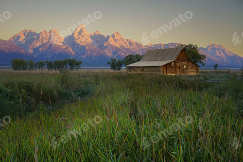 Preview: T.A. Moulton Barn set against the backdrop of the Grand Teton mountains during sunset in Wyoming