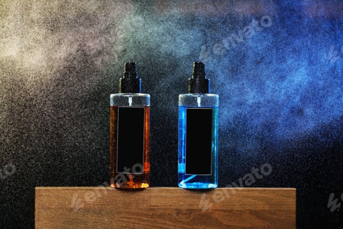 Preview: two bottles with yellow and blue liquid. two spray spraying cans on black background on wooden stand