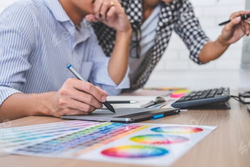 Preview: Young creative team having a meeting in creative office