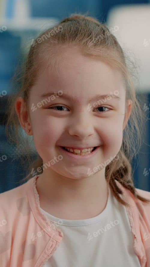 Preview: Close up of little girl sitting at desk and preparing to do homework