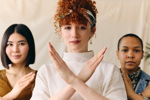 Preview: Young white woman gesturing Break The Bias in support of International Women's Day