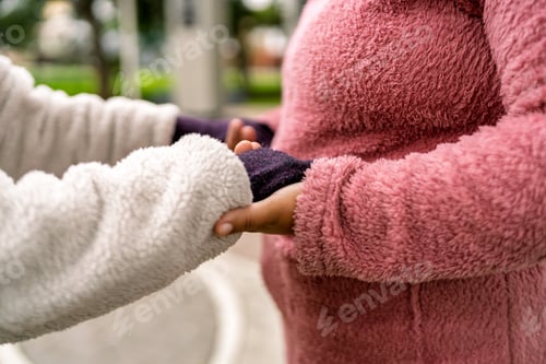 Preview: Nurse assisting elderly woman during walk in park