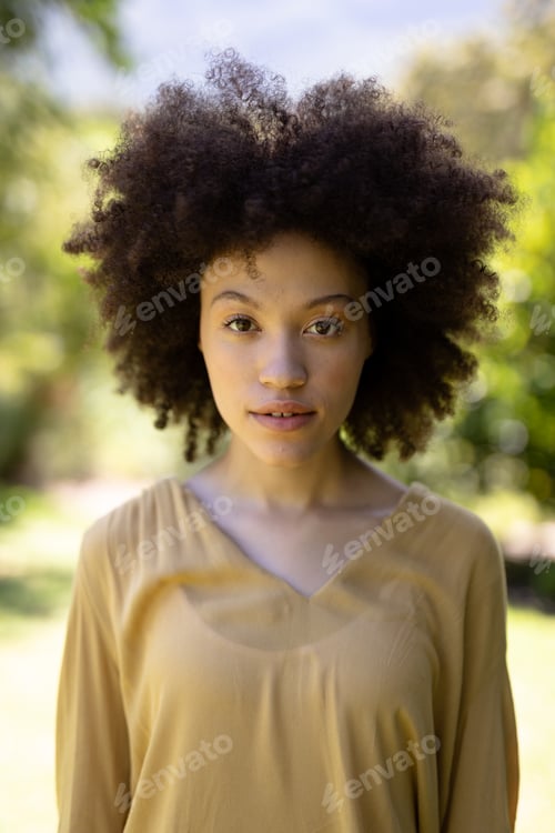 Preview: Portrait of a mixed race woman enjoying her time at the garden