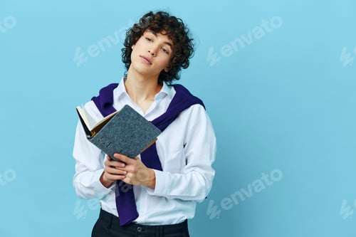 Preview: guy with a notepad in a sweater shirt on the shoulders Lifestyle school