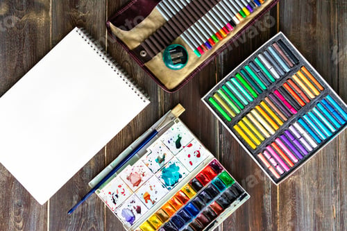 Preview: art workplace, color pencils, brushes, watercolor paints, paper crayon pastel chalks