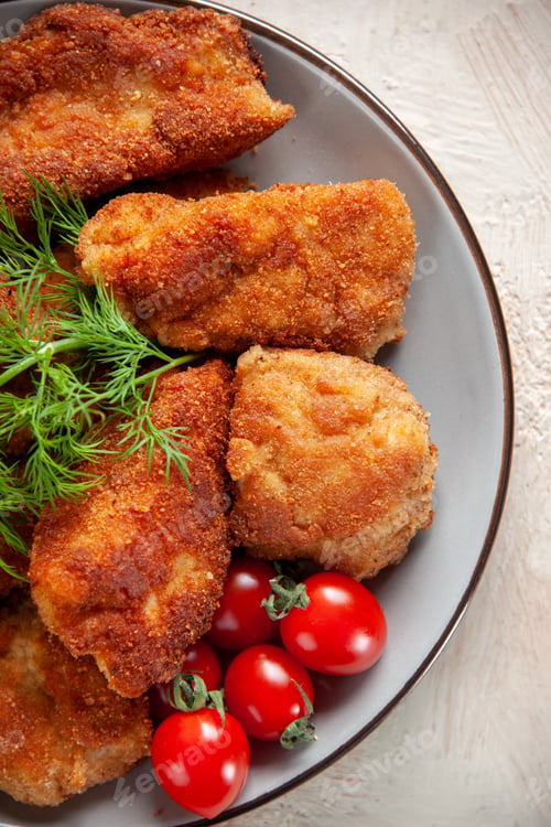 Preview: top view tasty chicken wings with greens inside plate on light background meat horizontal sandwich