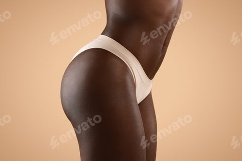 Preview: Closeup of african american woman in panties showing slender body