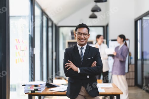 Preview: Portrait of success asian male office worker in formal business suits smiling at camera in office