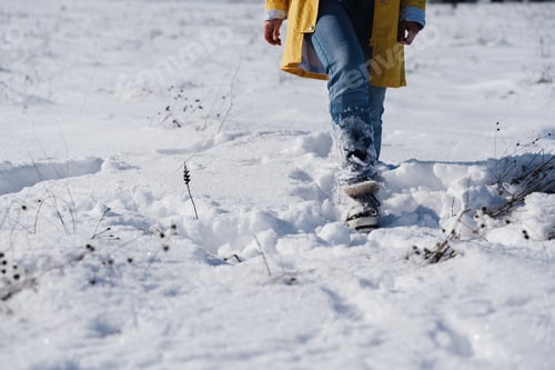 Preview: happy woman hiking outdoors in snowy mountain. Nature and lifestyle