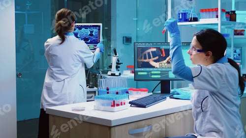 Preview: Group of scientists wearing lab coat working in laboratory