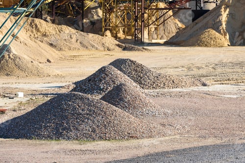 Preview: Pile of gravel and sand piled up in a quarry for sale and use in construction.