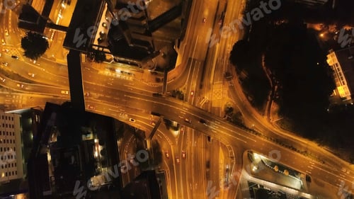 Preview: Top view interchange of a city at night. Stock. Important infrastructure in city. Top view of the