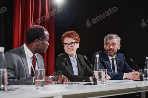 Preview: Business colleagues sitting at conference