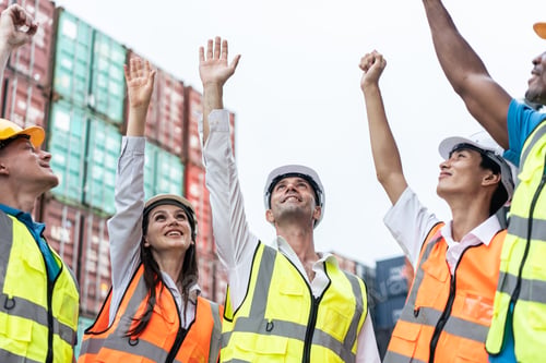 Preview: Group of young male and female worker working in container terminal.
