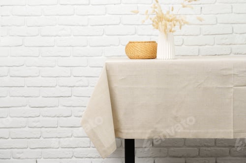 Preview: White Brick Wall With Beige Tablecloth and Basket
