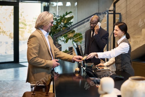 Preview: Conducting Business Payment at Hotel Reception Desk