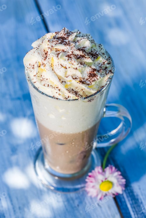 Preview: Cold latte with whipped cream on old wooden table
