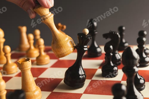 Preview: Hand of player chess board game putting white pawn